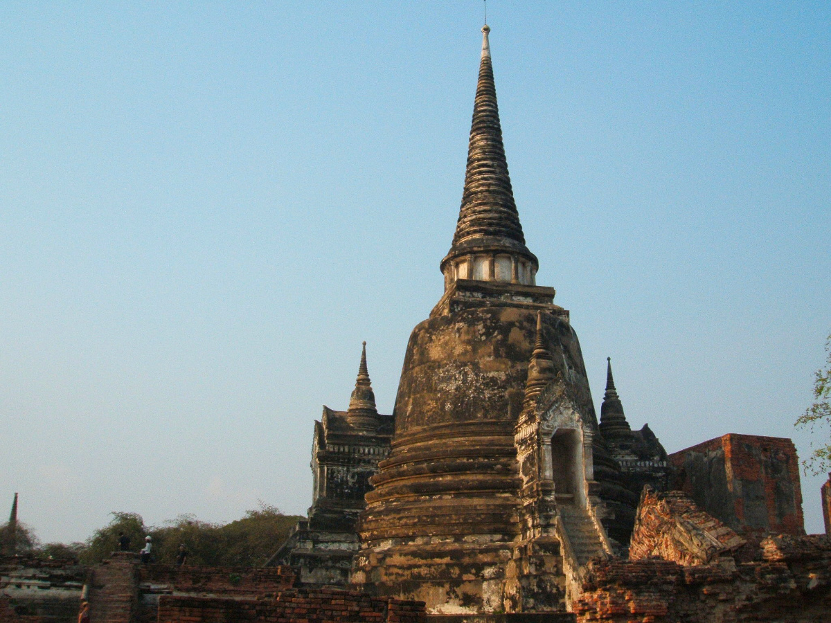Ancient temple stupas of Ayutthaya against a blue sky
