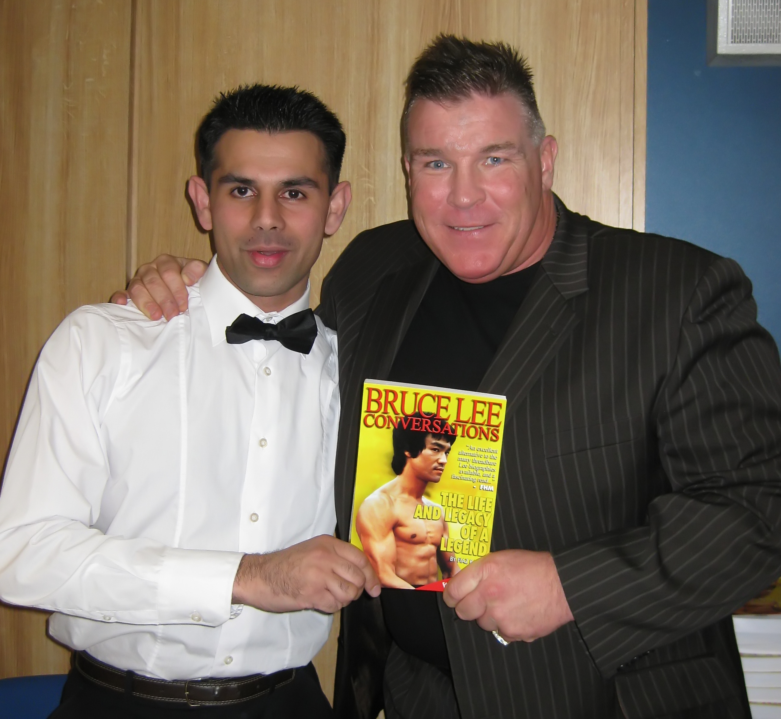 Big Joe Egan and Fiaz Rafiq holding the Bruce Lee Conversations book