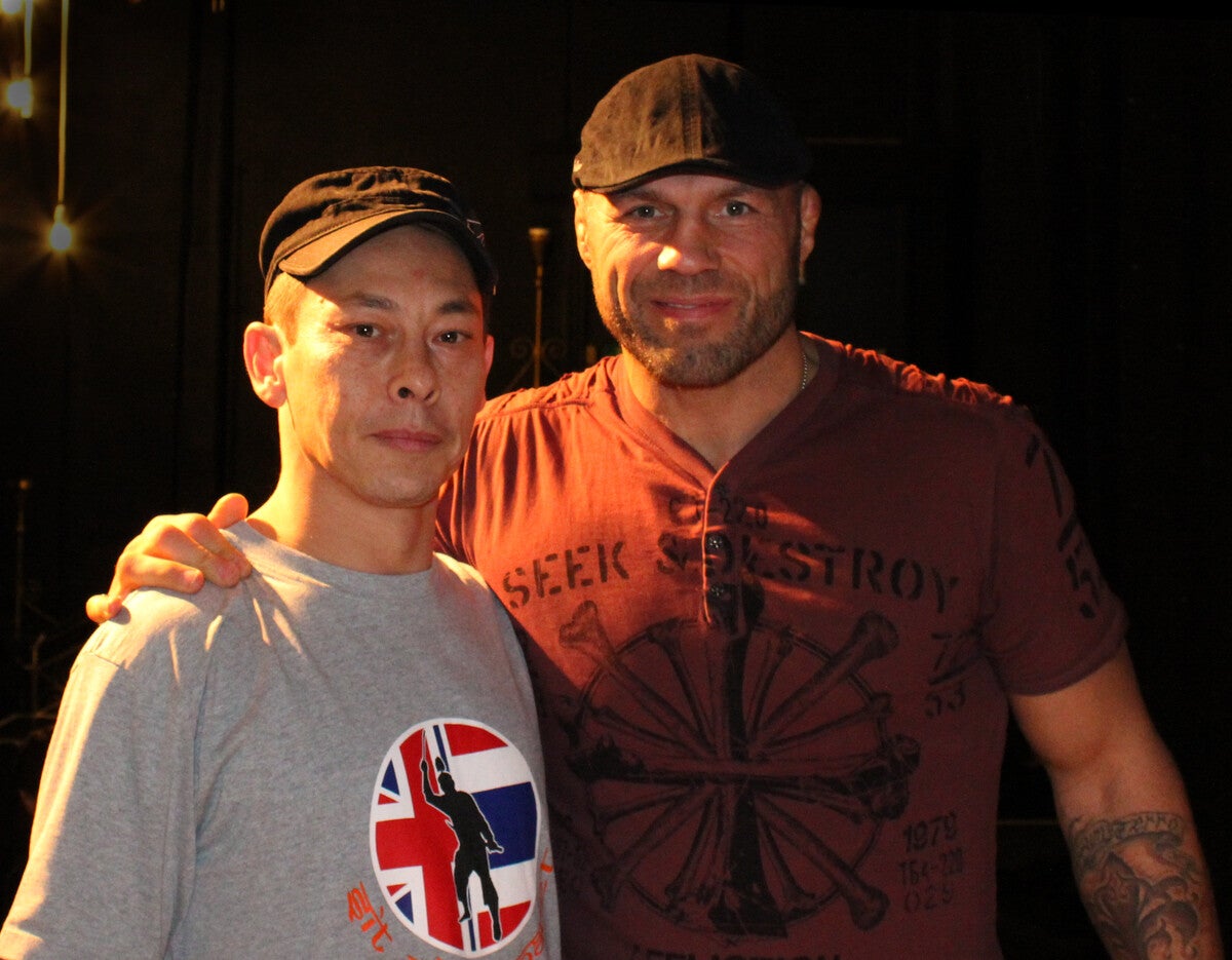 Darron Chadwick and Randy Couture at Liverpool Olympia 2011, both wearing caps
