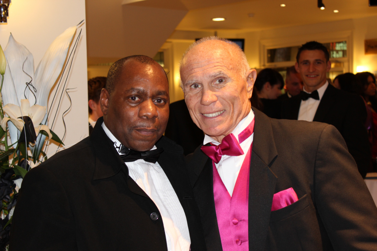 Ronnie Green in black tuxedo with Bill Super Foot Wallace in his signature pink waistcoat and bow tie at the Martial Arts Hall of Fame Awards