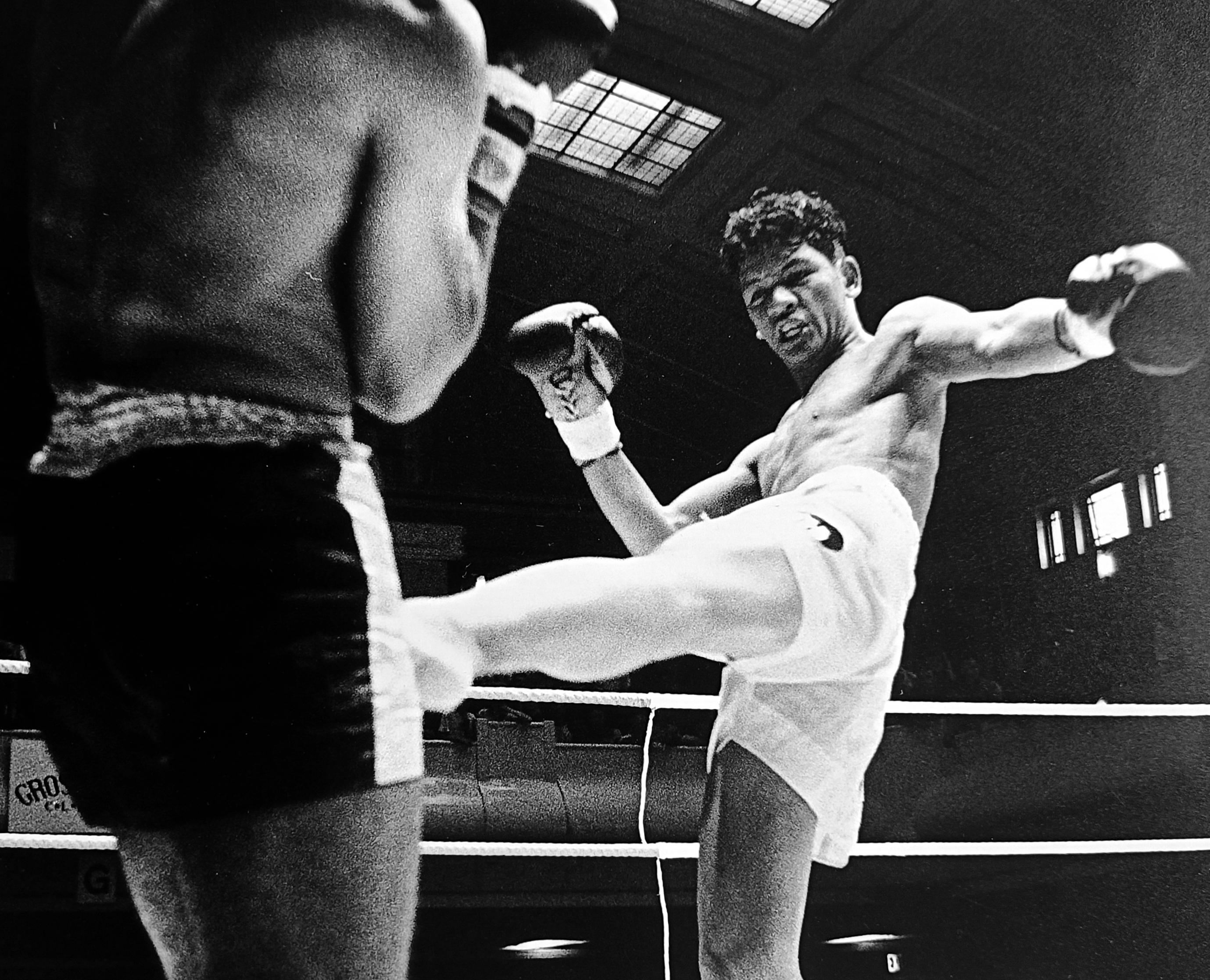 Thai fighter throwing a powerful kick